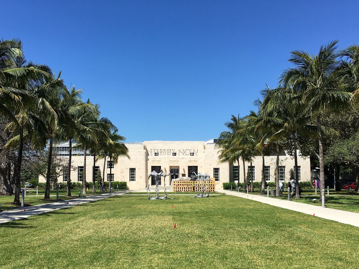 Palm-lined lawn of Collins Park leading to The Bass museum